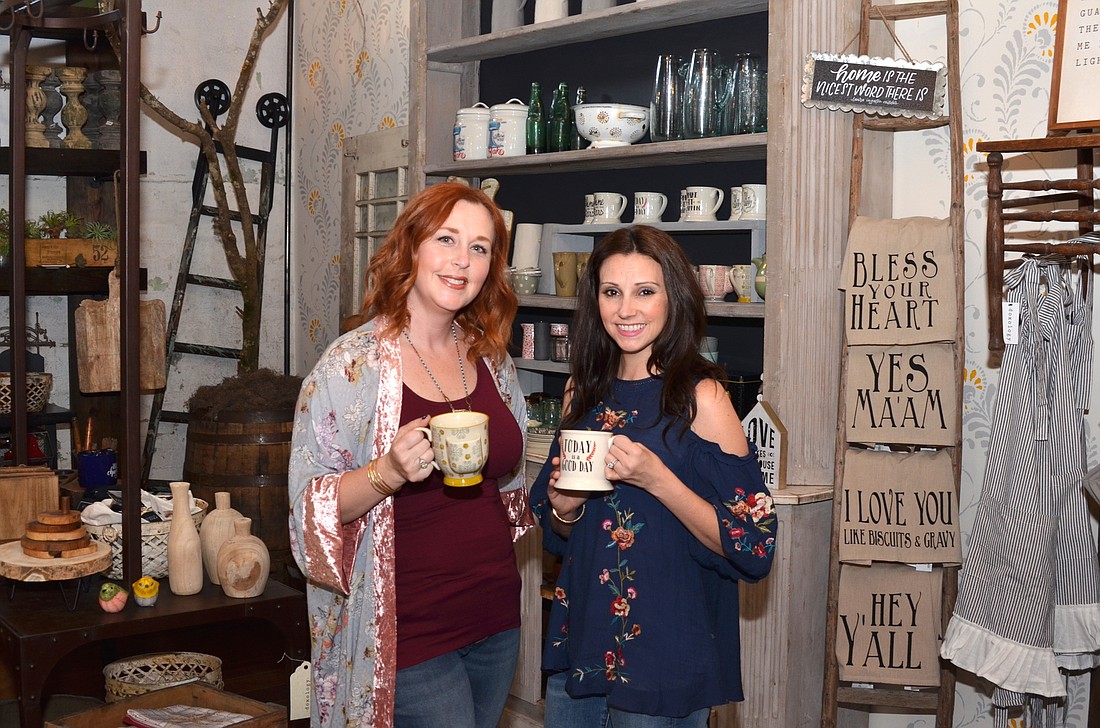 A variety of kitchen and household goods are for sale at Doxology, the new Winter Garden shop opened by Christy Reynolds, left, and Erika Swart.