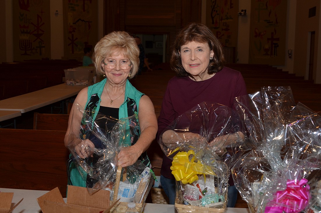 Linda Holbrook and Sherry Hurt were among the volunteers creating the Motherâ€™s Day baskets at Oakland Presbyterian Church.