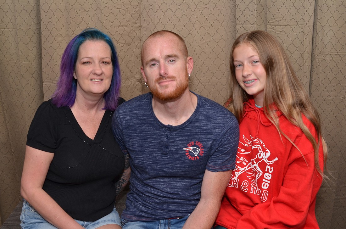 Lincoln Davis is grateful for all the people who provided lifesaving measures one year ago, including his wife, Leyia Davis, left, and stepdaughter, McKenzy Walker.