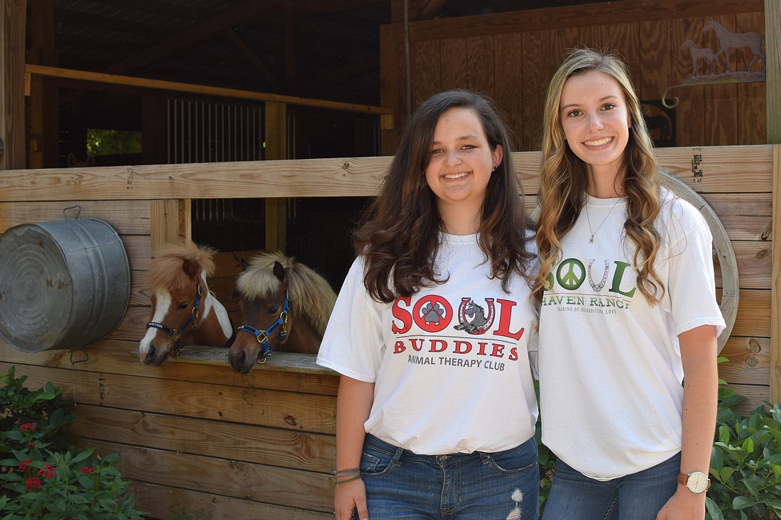 Windermere High junior Karlen Randle and West Orange High junior Amber Wilkison are pursuing community projects to earn their Girl Scout gold awards.