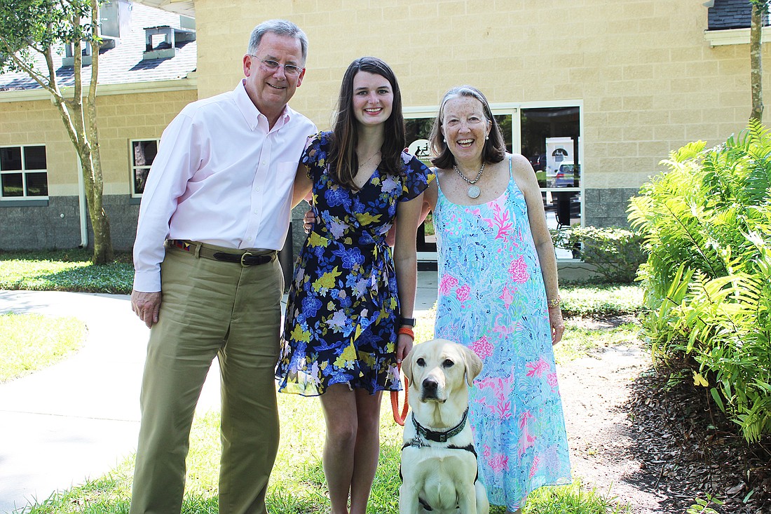 Paul Sanchez, Lauren Armstrong, Elroy and Robin Sanchez were all proud of Elroy as he graduated and became a hearing dog for Armstrong.