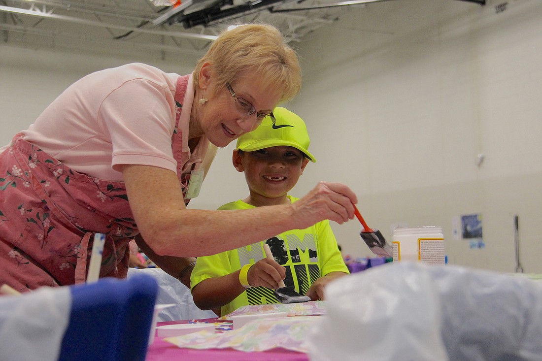 Jakob Radke, right, was all smiles as he created crafts with his nana, Anita Vrionides at Take pART 2018.