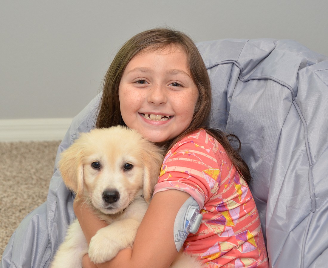 Loki will play an important role in 9-year-old Scarlett Bertschâ€™s life as her diabetic alert dog.