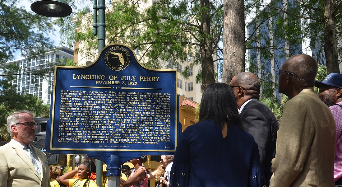 The two-sided historical marker tells the story of July Perry and his death, one part of a long history of sacrifices made by black Americans for civil rights.