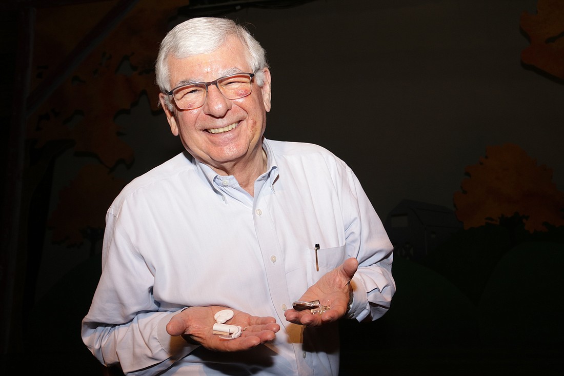 Gene Columbus, former executive director of The Orlando Repertory Theatre, proudly held up his hearing aid and cochlear implant transmitter. Despite suffering from hearing loss, heâ€™s lived a successful, lifelong career in entertai
