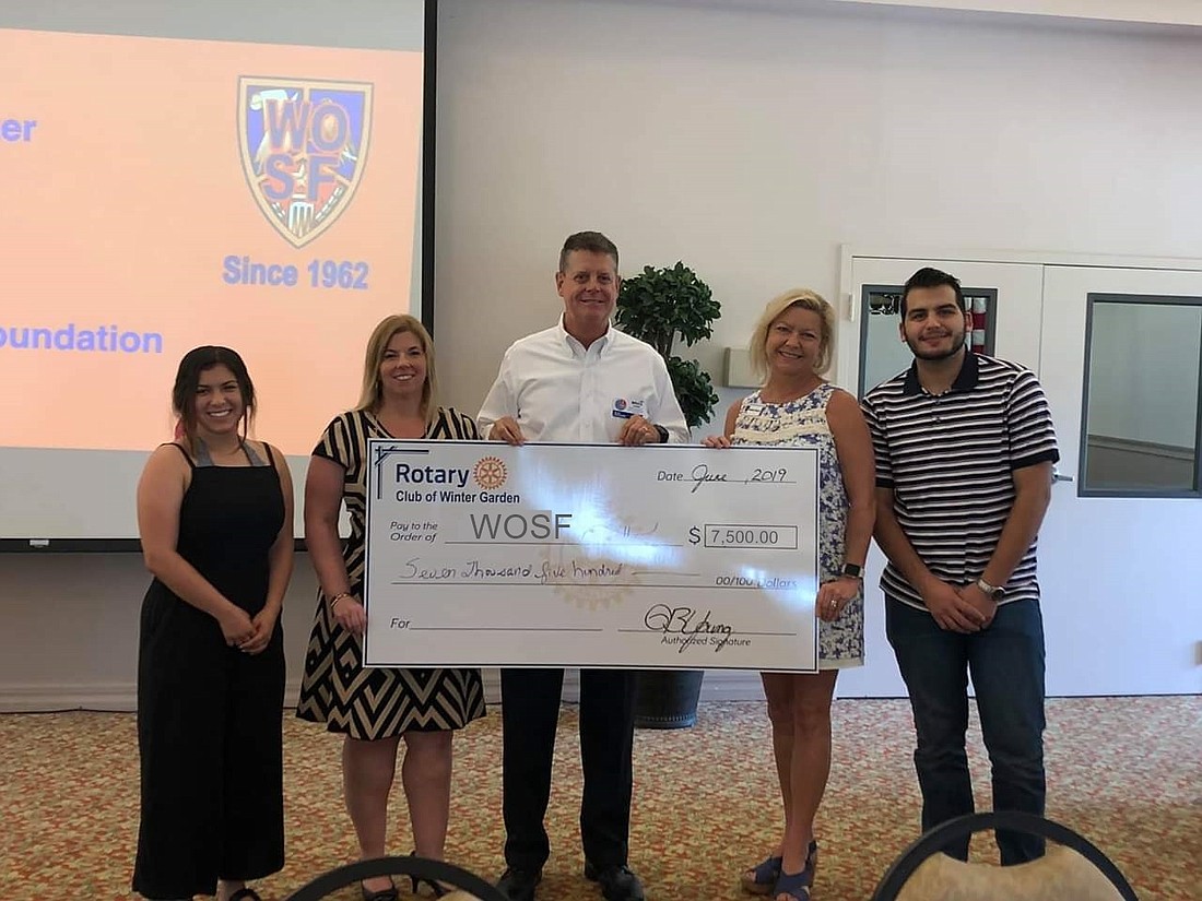  WOSF President Kathee Pierce and VP Beth Wincey attended the Rotary meeting to receive their check, along with new recipients, Hayley Plaza-Caprio and Orlando Medina.