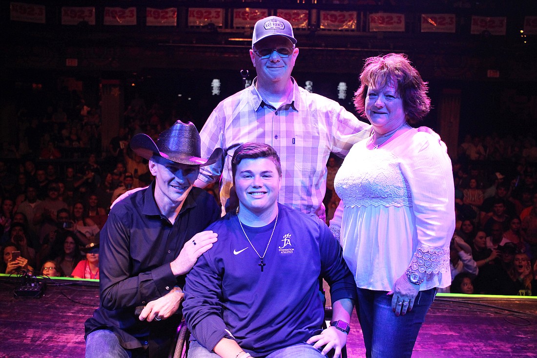 Patrick Gibson, left, and Brian, Bailey and Betsy Trinder shared a special moment together on stage at the House of Blues.