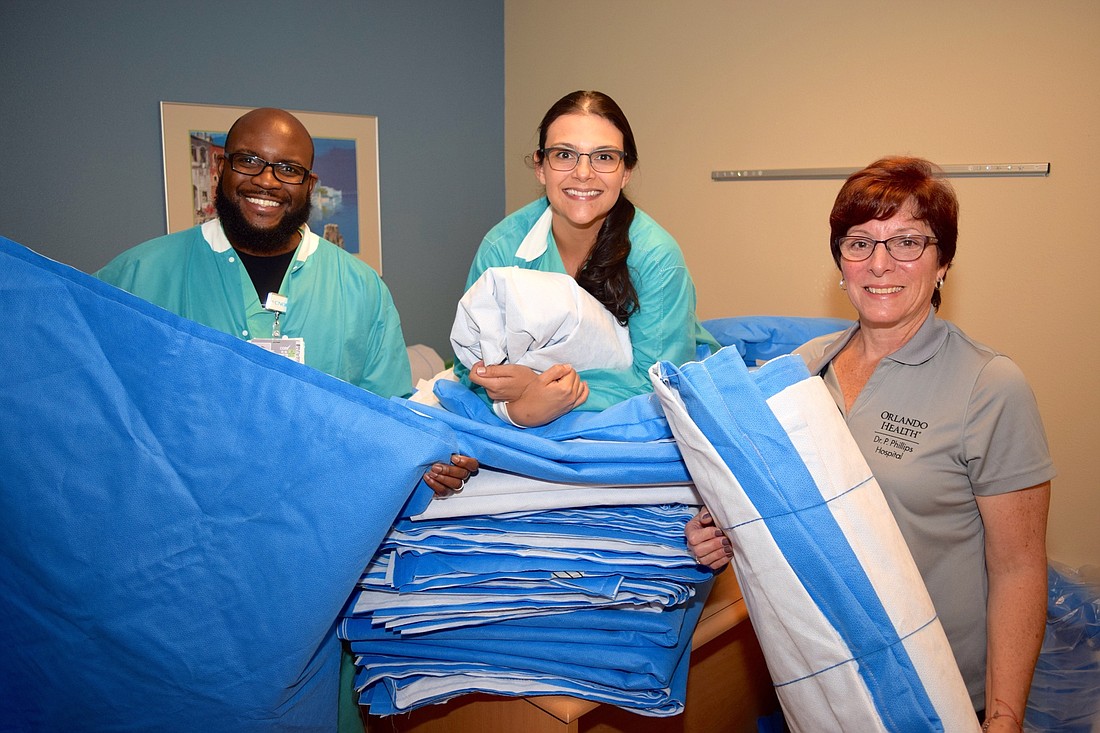 Registered nurses Cory McFarlane, Desiree Bagley and Karen Sammartino are part of the team that has been assembling the sleeping bags.