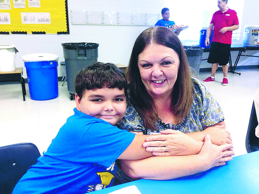 Gail Kiehm and one of her grandchildren, Joshua Rucker, during Grandparents Day at Frangus Elementary.