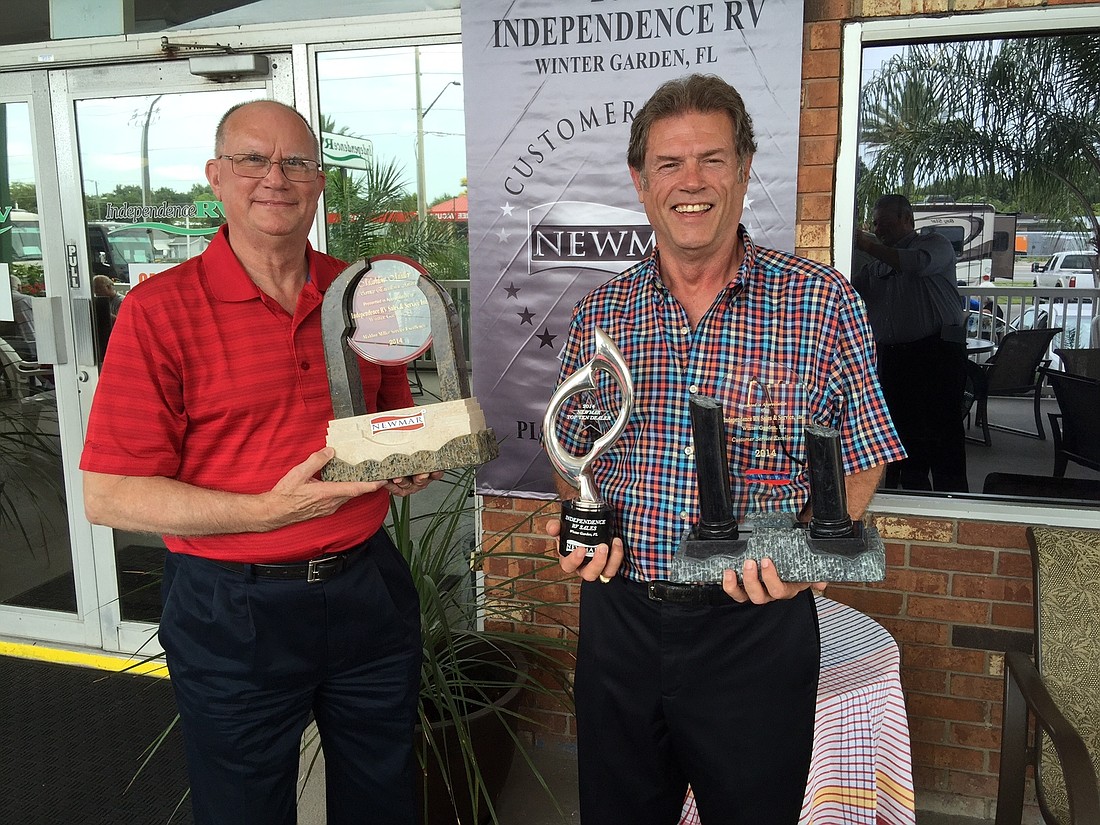 Richard Parks, left, president of Newmar Corp., presented Independence RV President and Owner Ronnie Jordan with three awards, including one for being Newmarâ€™s 2014 Top 10 Dealer and a customer-service excellence award. (Courtesy photo.)