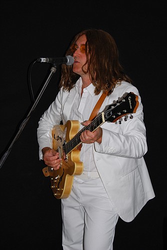Carm Castiglione performs as John Lennon.