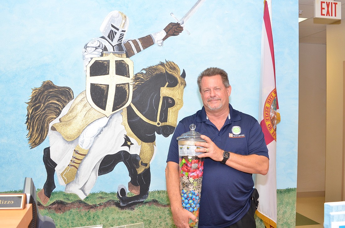 Bill Floyd is the new principal at West Orange High School after leading Ocoee High for six years. Each year at graduation, seniors gave him a small token, and the jar includes each of the graduating classes' gifts to him.