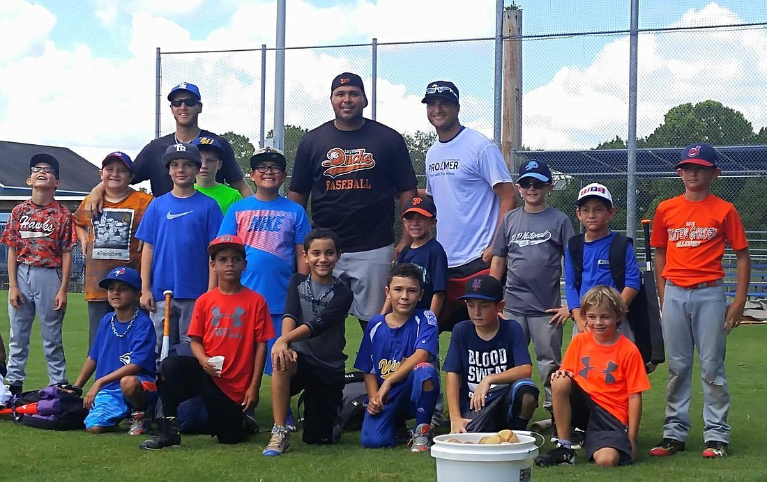 PRO4MER and partnering professional athletes held a summer camp with Dr. Phillips Little League earlier this summer. From left: Former pitcher Adrian Martin, former major leaguer Randy Ruiz and PRO4MER founder James Parr.