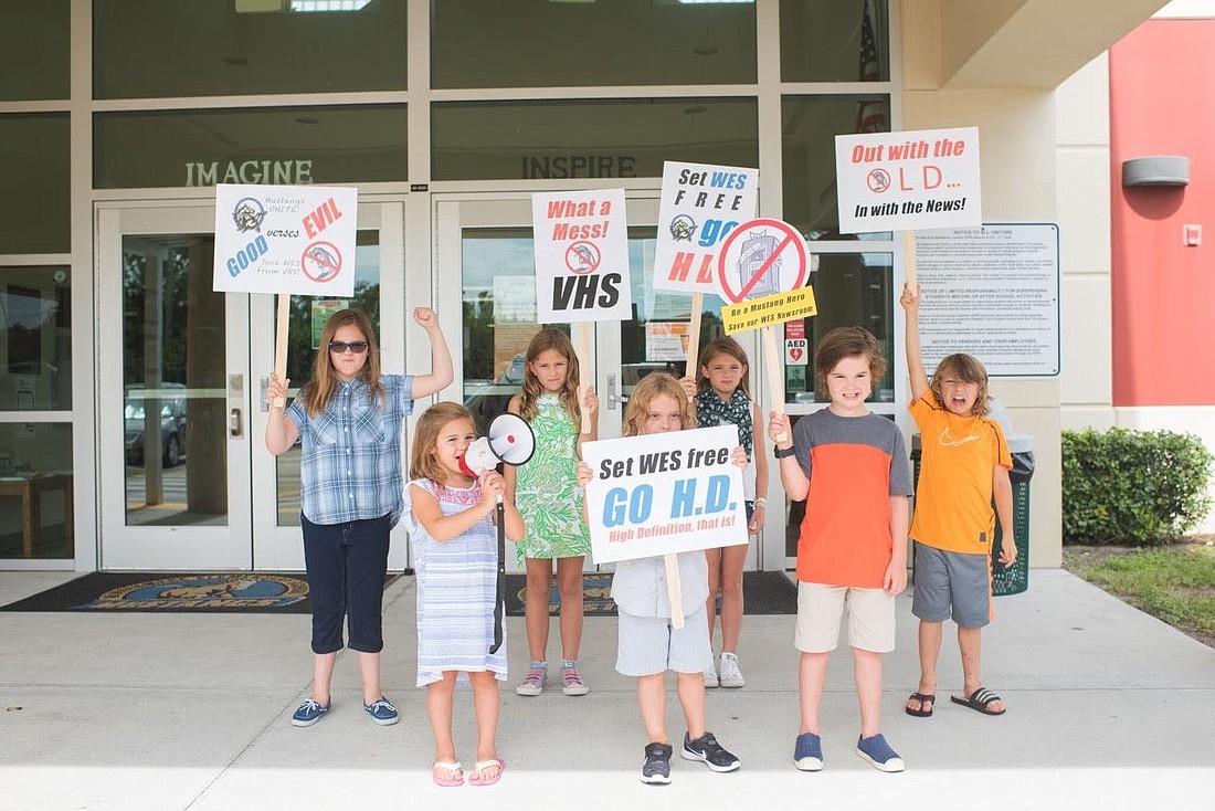 Windermere Elementary students stage a protest to raise awareness of the school's funding needs for technology upgrades.