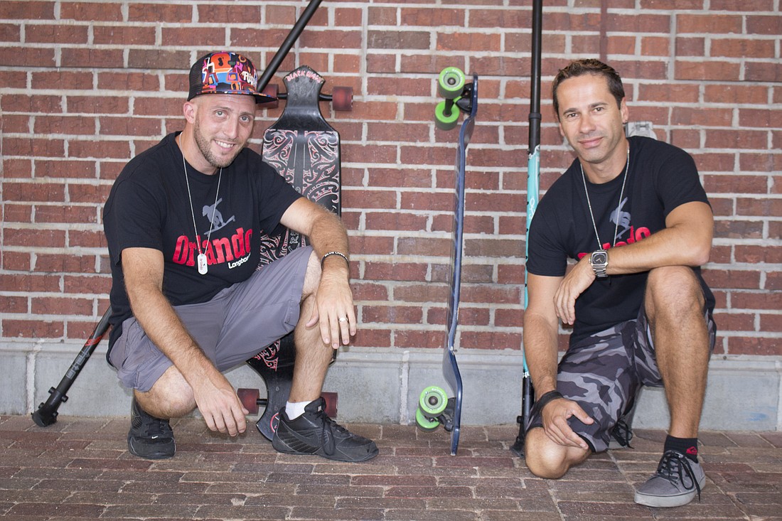 Adam Rubman (left), and Mark Houghton are using skateboards and sticks to promote fun workouts and their new longboard business.