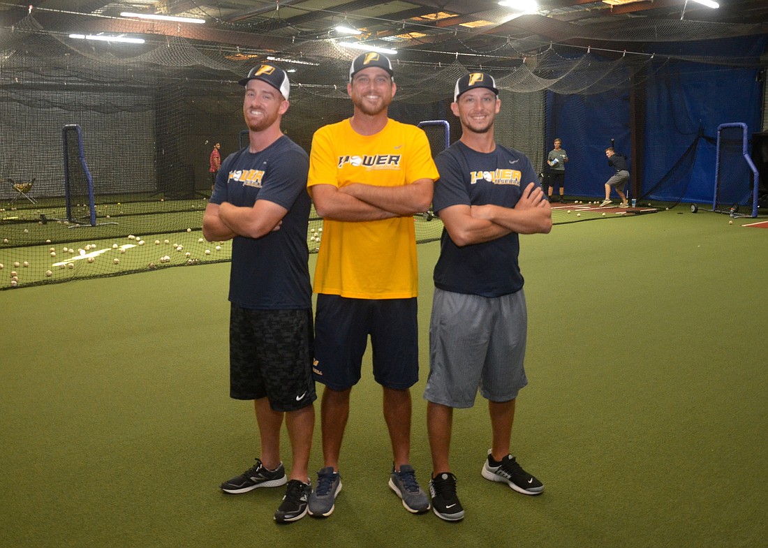 Brian Dempsey, left, Eric Lassiter and Jesse Marlo are three of the four minds behind Power Baseball.