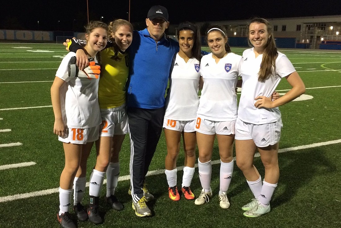 The West Orange soccer team&#39;  s seniors pose for a photo with coach Patrick Moons. Courtesy photo
