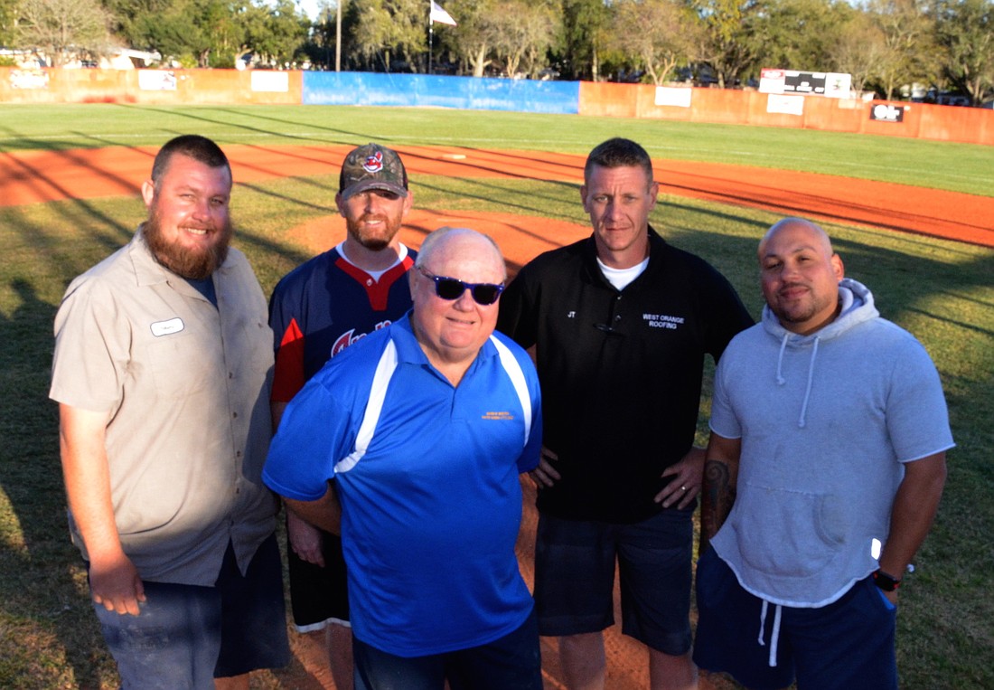 Robert Bowen, left, Josh Steele, Mike Rowe, JT Wells and Luis Gomez collectively spend 40 hours per week upkeeping the leagueâ€™s fields.