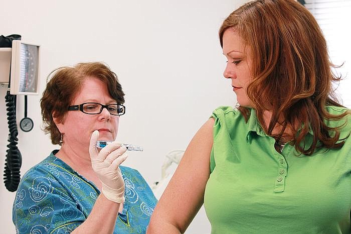 Photo by: Center for Disease Control - The CDC is pushing for more inoculations to boost people's chances of avoiding the flu.