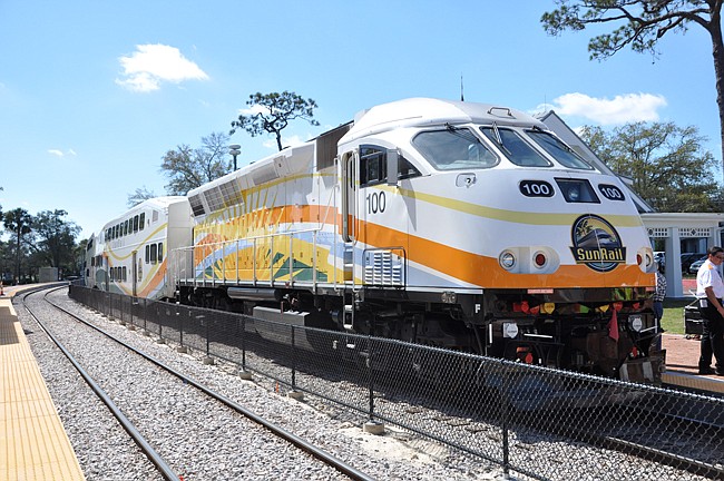 Photo by: Tim Freed - Weekend service of SunRail for the Winter Park Sidewalk Art Festival helped steer an uptick in sales at local Park Avenue stores.