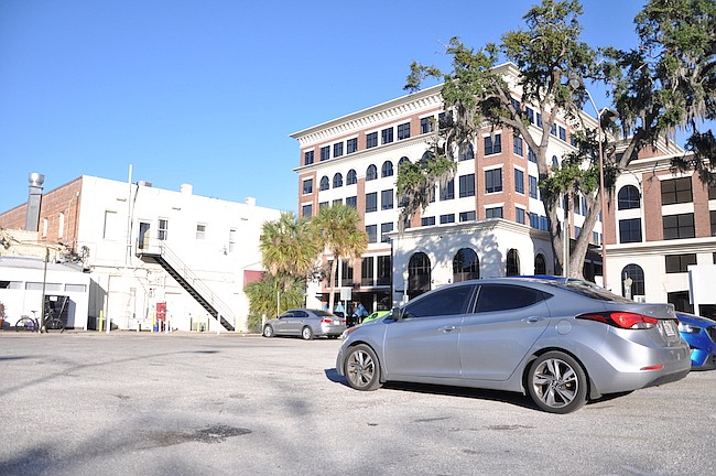 Photo by: Tim Freed - A parking lot just east of Park Avenue would be replaced by a building, and plans to add more parking have seen push back.