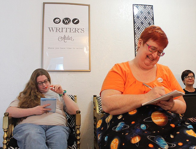 Photo by: Nicole Garcia - Local writers gather at Writer's Atelier in Winter Park as they prepare to take the challenge to write 50,000 words during the month of November. This writer's hideaway is hosting workshops to help.