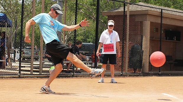 Photo by: Sarah Wilson - Maitland Mayor Howard Schieferdecker plays referee as fellow Council member John Lowndes gets in his kicks for charity at the fifth annual Friends of First Response Kickball Tournament on May 19.