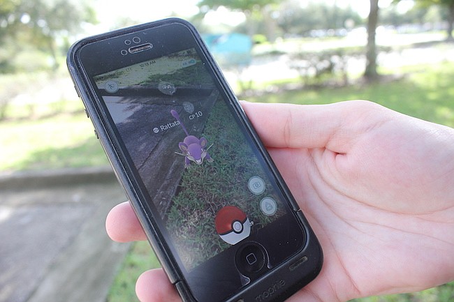 Photo by: Sarah Wilson - "Pokemon Go" caught fire over the summer, with players using their smart phones to find and capture game characters lurking in their neighborhoods in the game's augmented reality environment.