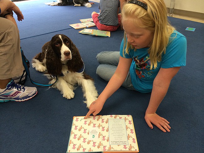 Photo courtesy of Winter Park Public Library - Paws to Read offers furry encouragement to get kids to read with a non-judgmental audience.