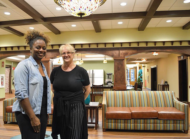 Photo by Paige Wilson - New Hope For Kids' Tamari Miller, left, and Gloria Capozzi help kids through the grieving process at their new facility in Maitland with 11 program rooms.