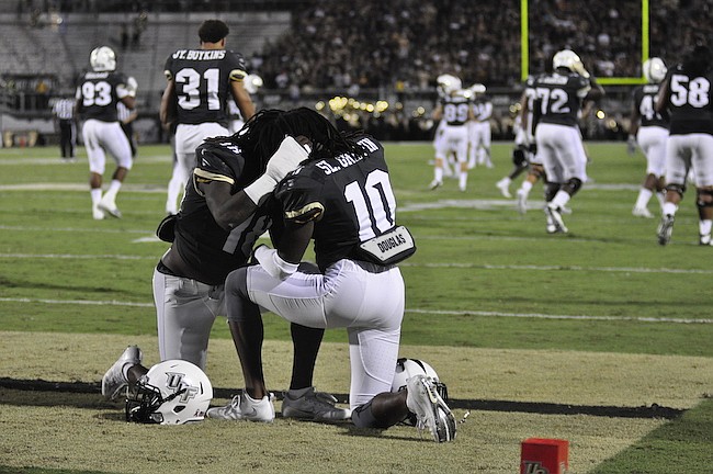 Photo by: Isaac Babcock - Knights head coach Scott Frost praised the defense from Shaquem and Shaquill Griffin in trying to stave off a comeback by Houston, but said offensive mistakes doomed the Knights.