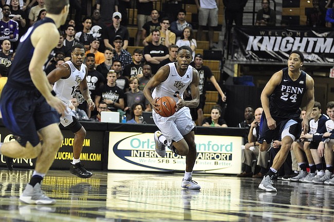 Photo by: Isaac Babcock - A.J. Davis turned a fast break into a dunk during a failed comeback against UConn after UCF was down by 18 points.