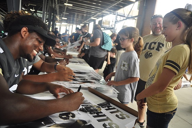 Photo by: Isaac Babcock - The Knights held their annual Football FanFest on Saturday, with thousands of UCF football fans showing up to have autographs signed by players and to meet new coach Scott Frost.