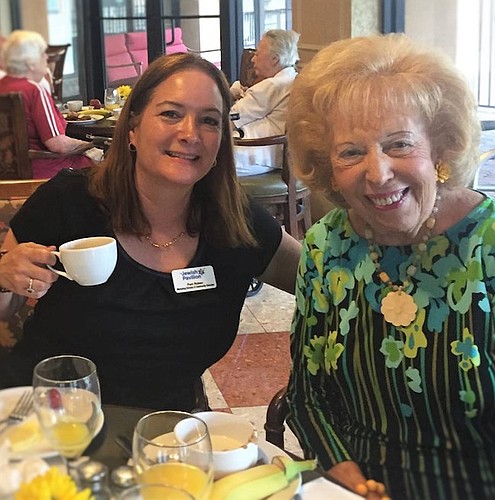 Photo by: Pamela Ruben - Gloria Newberger, 87, right, enjoys a meal at the Oakmonte Village Senior Retirement Community in Lake Mary.