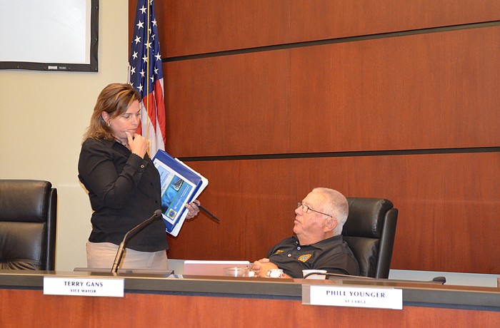 Assistant Town Manager Anne Ross and Commissioner Terry Gans discuss undergrounding issues after the commission voted 5-1 to approve a referendum for Gulf of Mexico Drive in November.