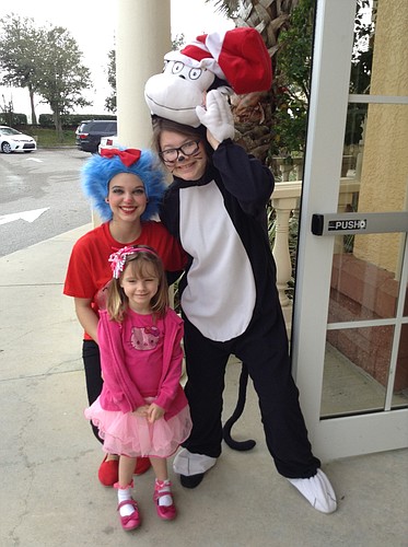 Thing 1 and Cat in the Hat pose with student Aubrey Hoonhout.