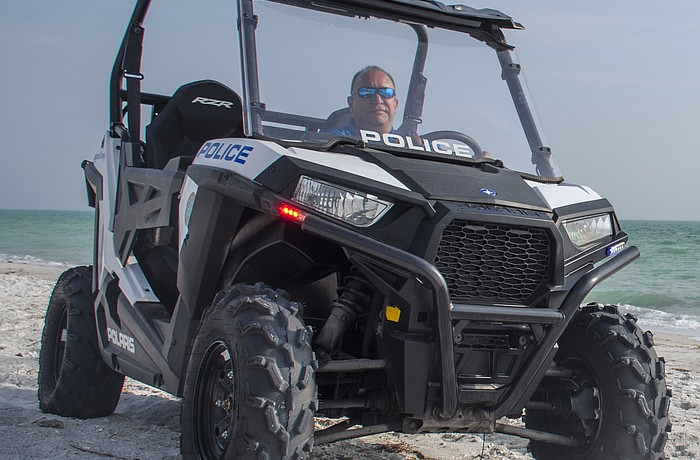 Sgt. David Cooper patrols the beach on the north end of the island in the Longboat Key Police Department's all-terrain vehicle.