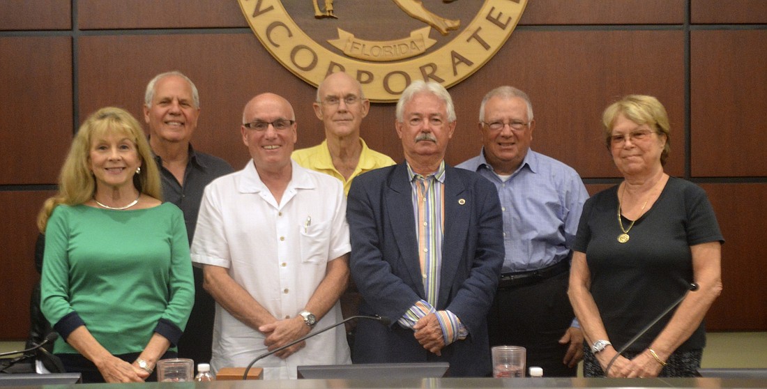 Mayor Jim Brown, fourth from left, will sign off tonight after six years on the Longboat Key Town Commission.