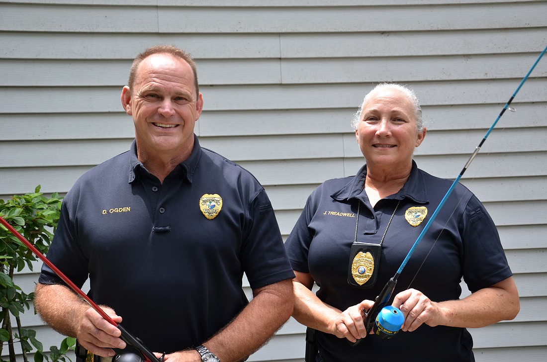 Windermere Police Dave Ogden and Deputy Chief Jennifer Treadwell tested a few fishing poles that were donated for the event.