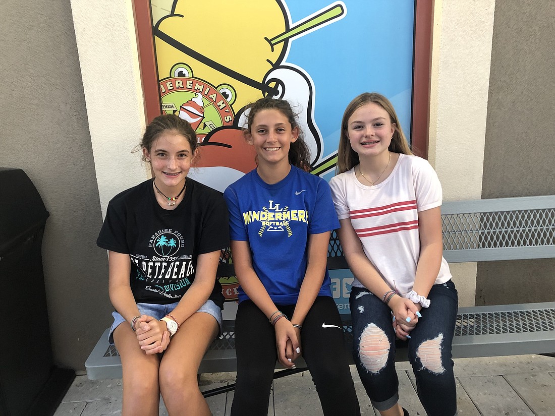 Eighth-graders Julia Trimble, left, Carly Bunnell and Samantha Zotti are three of the HOPE Clubâ€™s members.