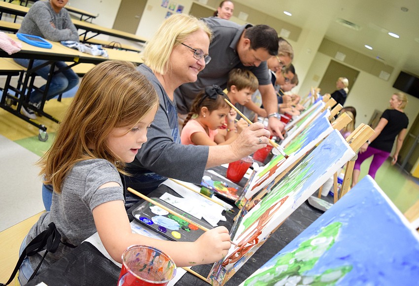 PHOTOS Water Spring Elementary Canvas Painting Spirit Night