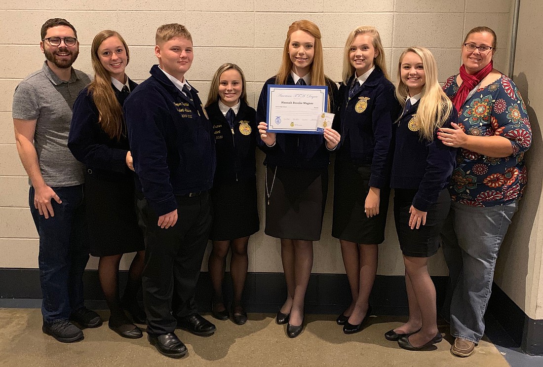Hannah Wagner, her FFA advisers, family and fellow FFA members celebrated her degree.