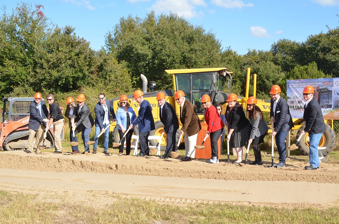 City and county officials, representatives from the technology firm and construction team mark the beginning of Rieglâ€™s journey to Winter Garden.