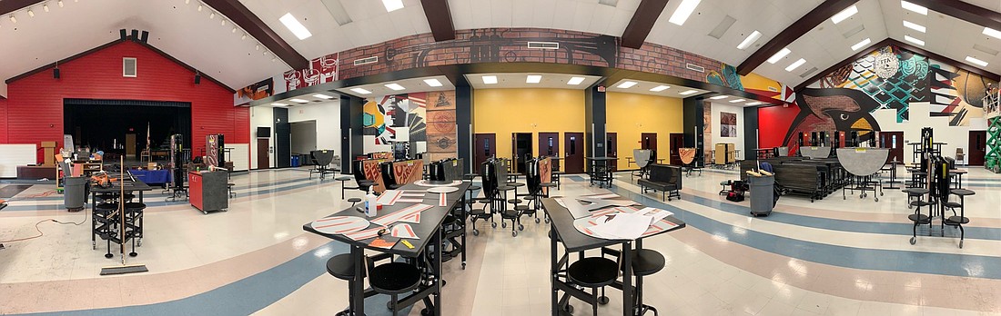  Murals representing different programs and the school mascot now adorn the walls of the Ocoee Middle School cafeteria.
