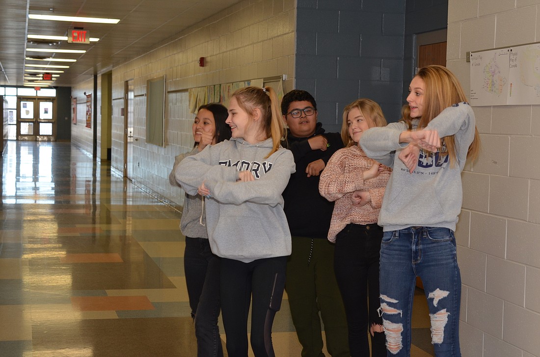 Kate Sandoval, left, Darcy Friday, Carlos Sandoval, Morgan Townsend and Amanda DiCastro coordinated their moves for a TikTok video.