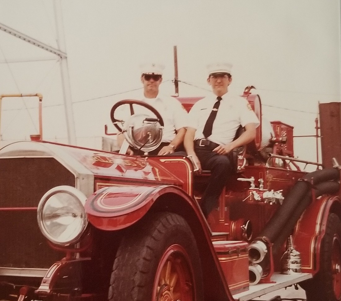 Then-Fire Chief Roy LaBossiere, left, and Assistant Fire Chief Randy Dollar took a seat in an American LaFrance fire truck.