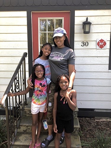 Melissa Desruisseaux and her daughters, Zielle Adams, in back, and twins Braelyn and Brianna Adams, in front, lived in Matthewâ€™s Hopeâ€™s transitional housing on Morgan Street