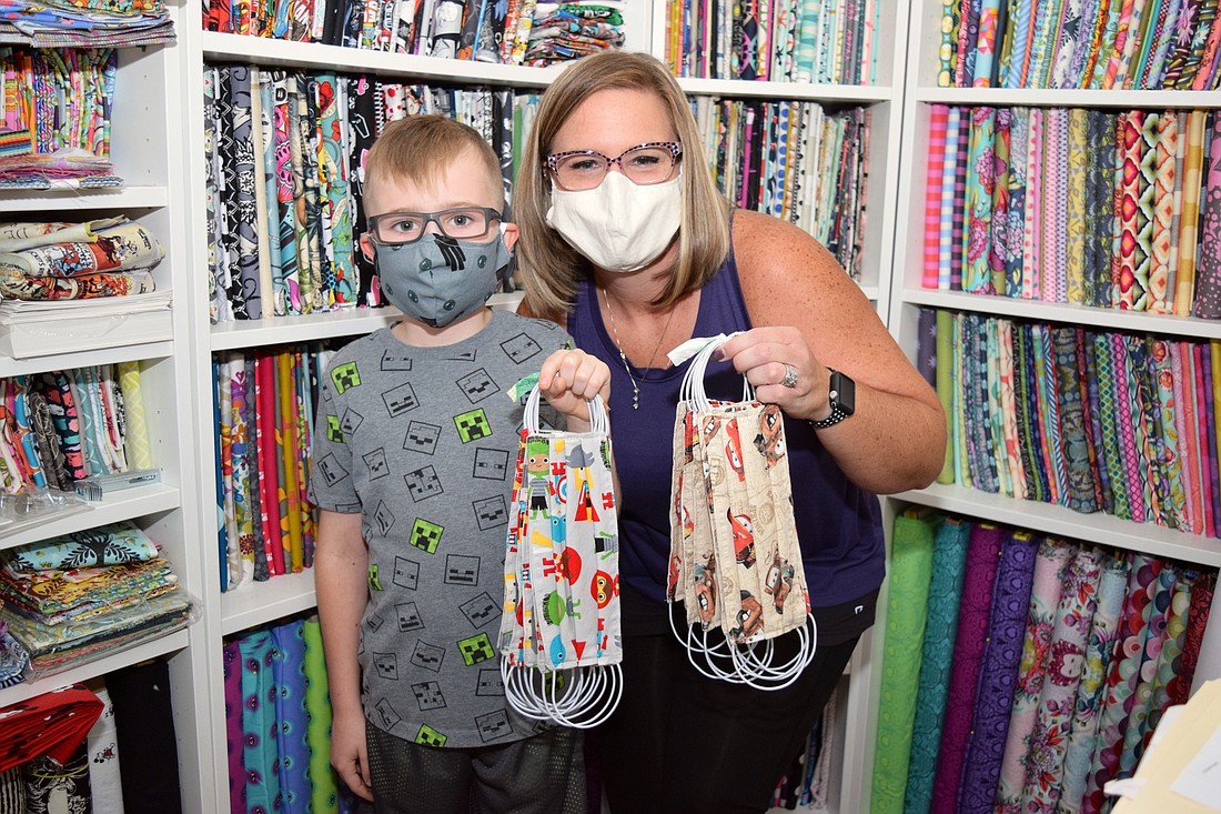 Erin Morris â€” pictured with son, Ronan â€” has sewn more than 200 fabric face masks to donate to health care workers and others in the community who need them most.