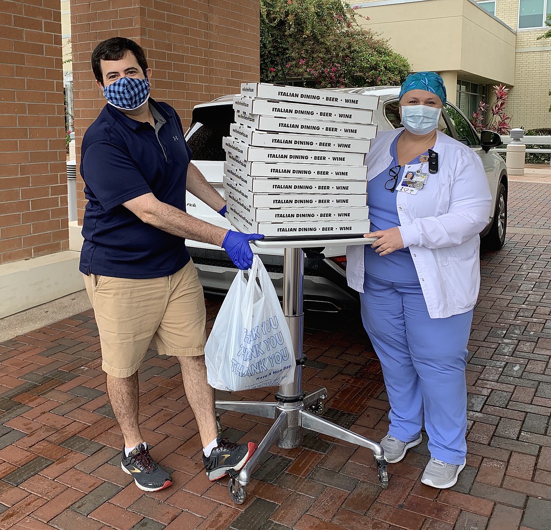 Stephen Facella, owner of Winter Garden Pizza Company, delivered a stack of pizzas to the ICU at Orlando Health South Lake Hospital last week.