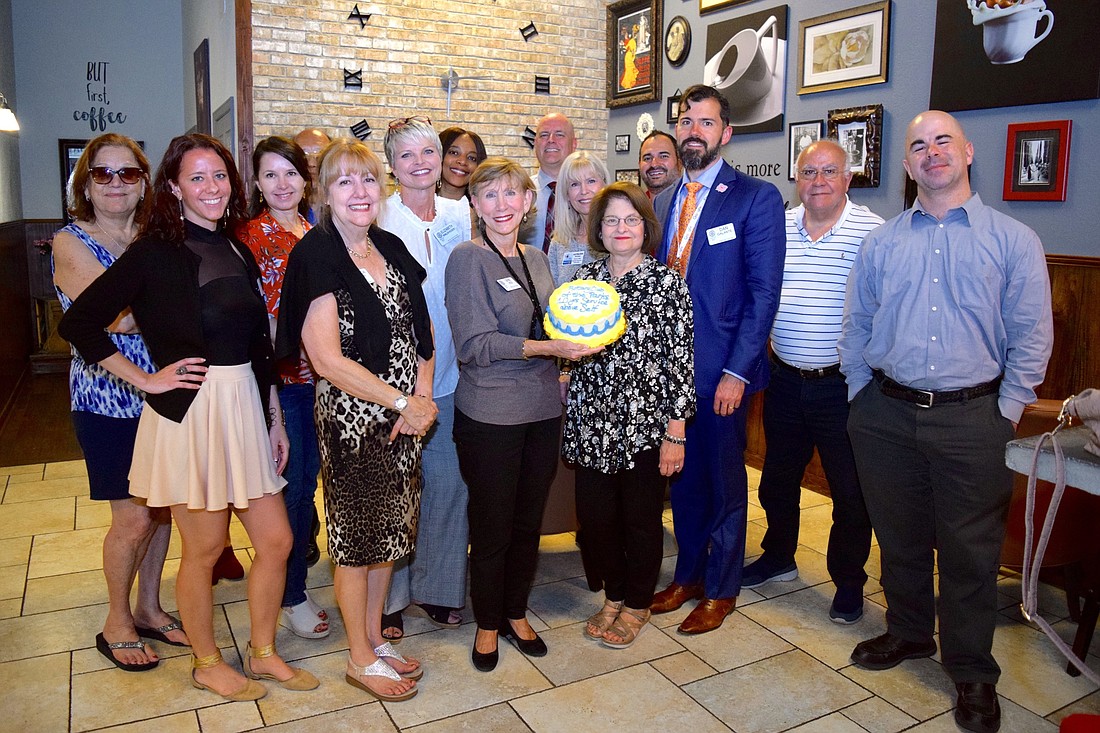 Members and guests in attendance at the Rotary Club of the Parksâ€™ March 11 meeting celebrated the clubâ€™s 10th anniversary with a special cake.
